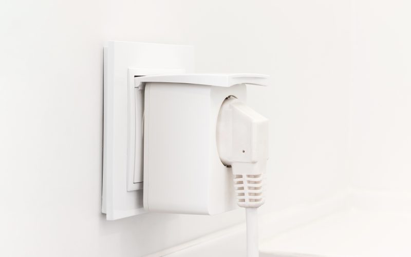 Electrical outlet with smart plug on modern bright bathroom
